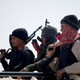 Libyan rebels deploy at the western gate of the strategic restivetown of Ajdabiya. (Marwan Naamani/AFP/Getty Images)